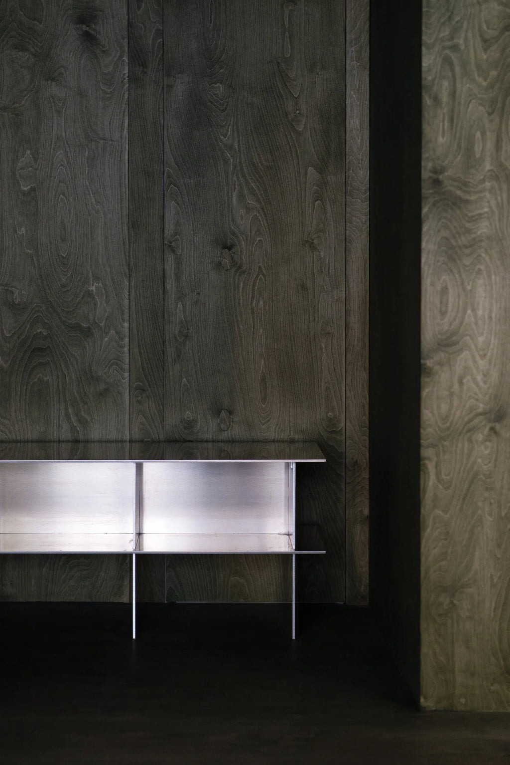 Glossy Metal Minimalist TV Stand displayed against a neutral wall