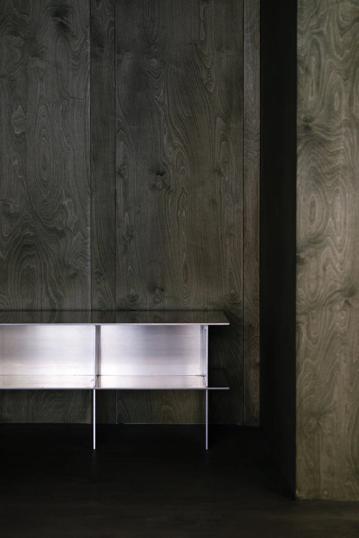 Glossy Metal Minimalist TV Stand displayed against a neutral wall