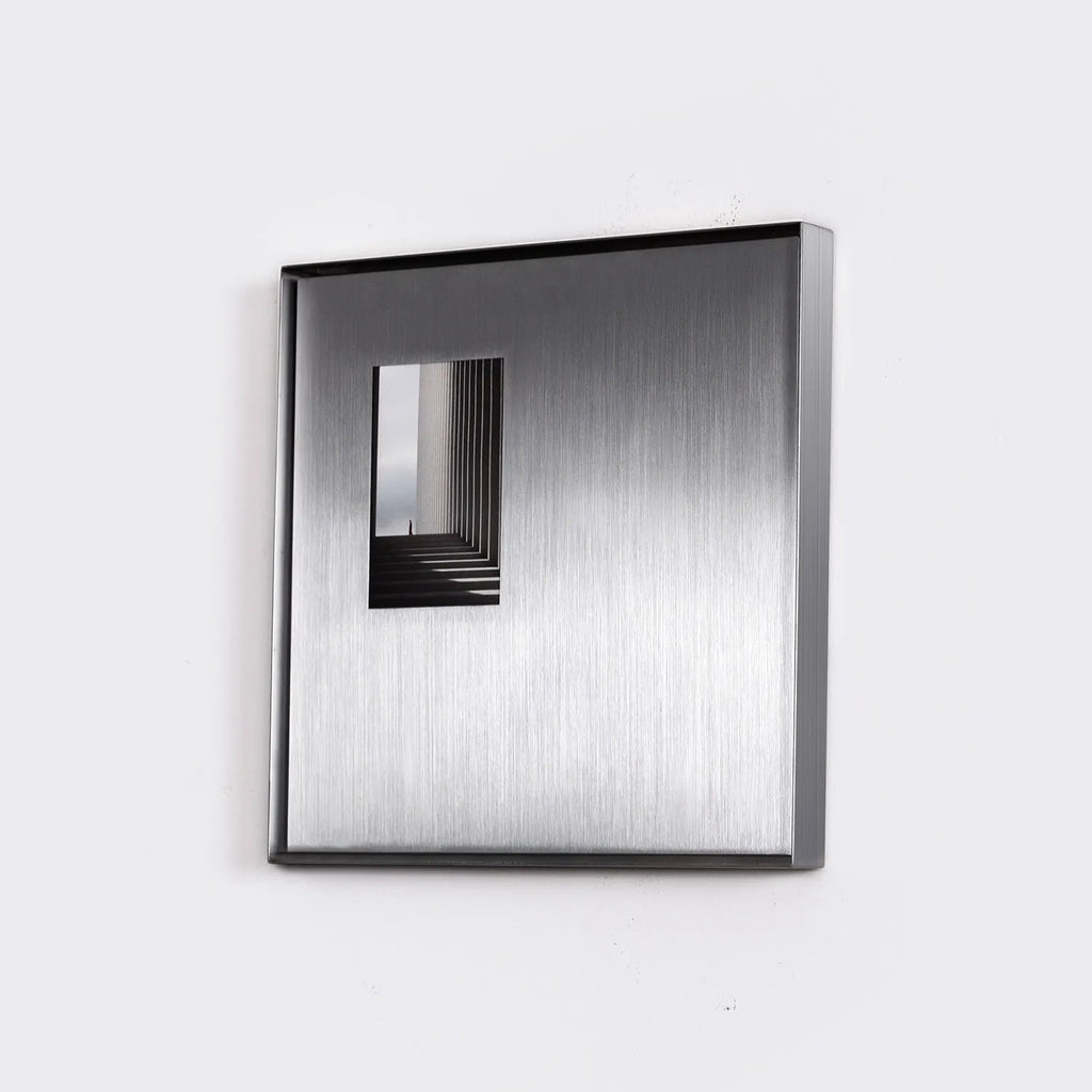 Square Stainless Steel Picture Frame shown in a stylish interior