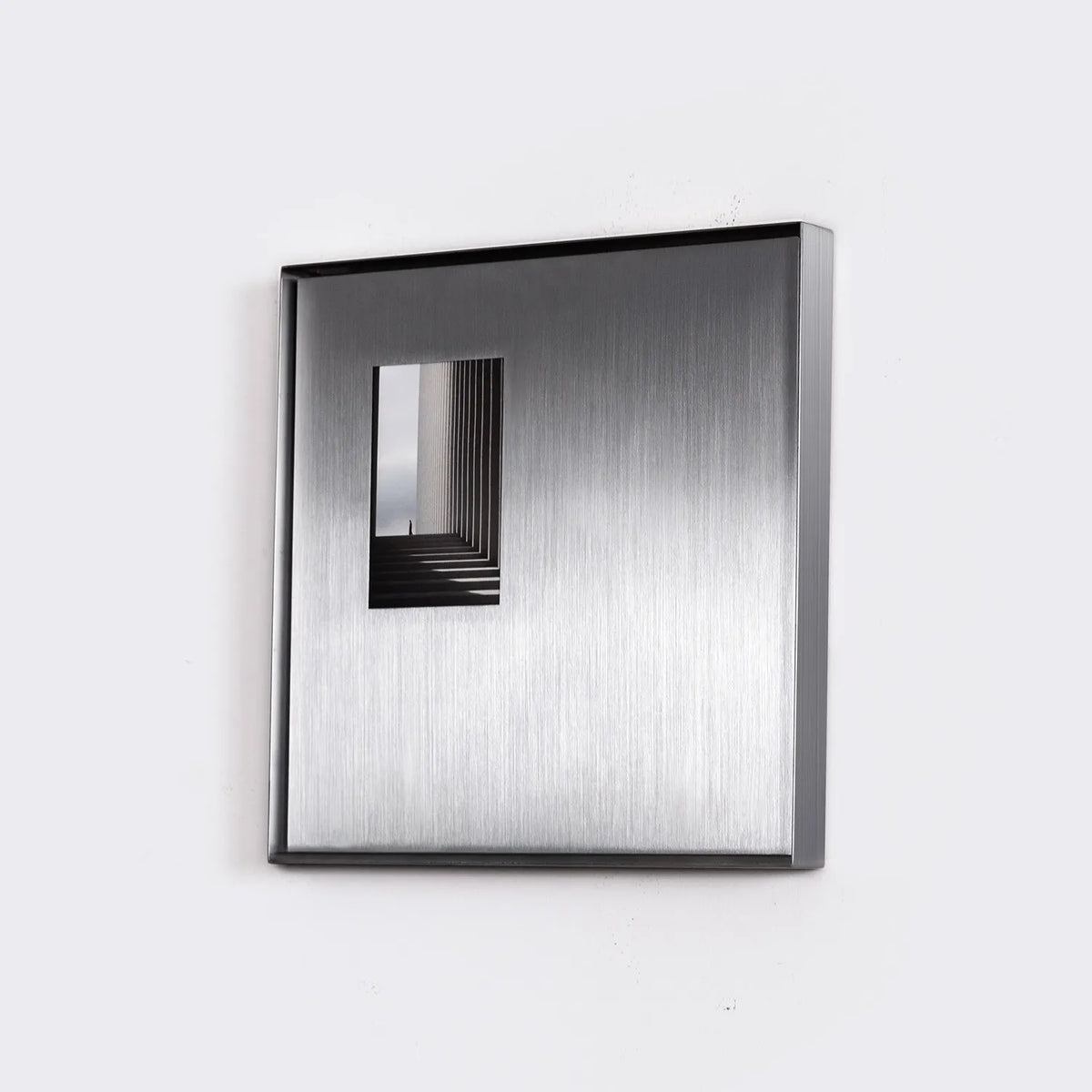 Square Stainless Steel Picture Frame shown in a stylish interior