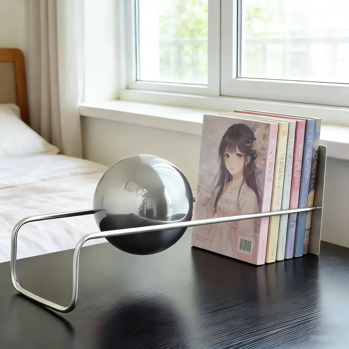 Sculptural Metal Desktop Organiser with the silver sphere and books