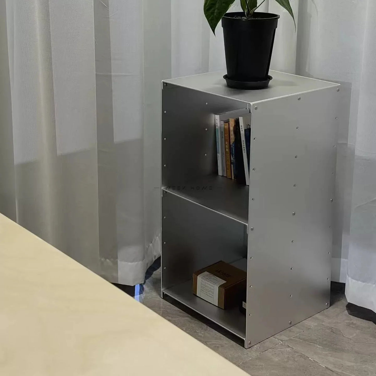 Bauhaus Modular Stainless Steel Shelf with a potted plant