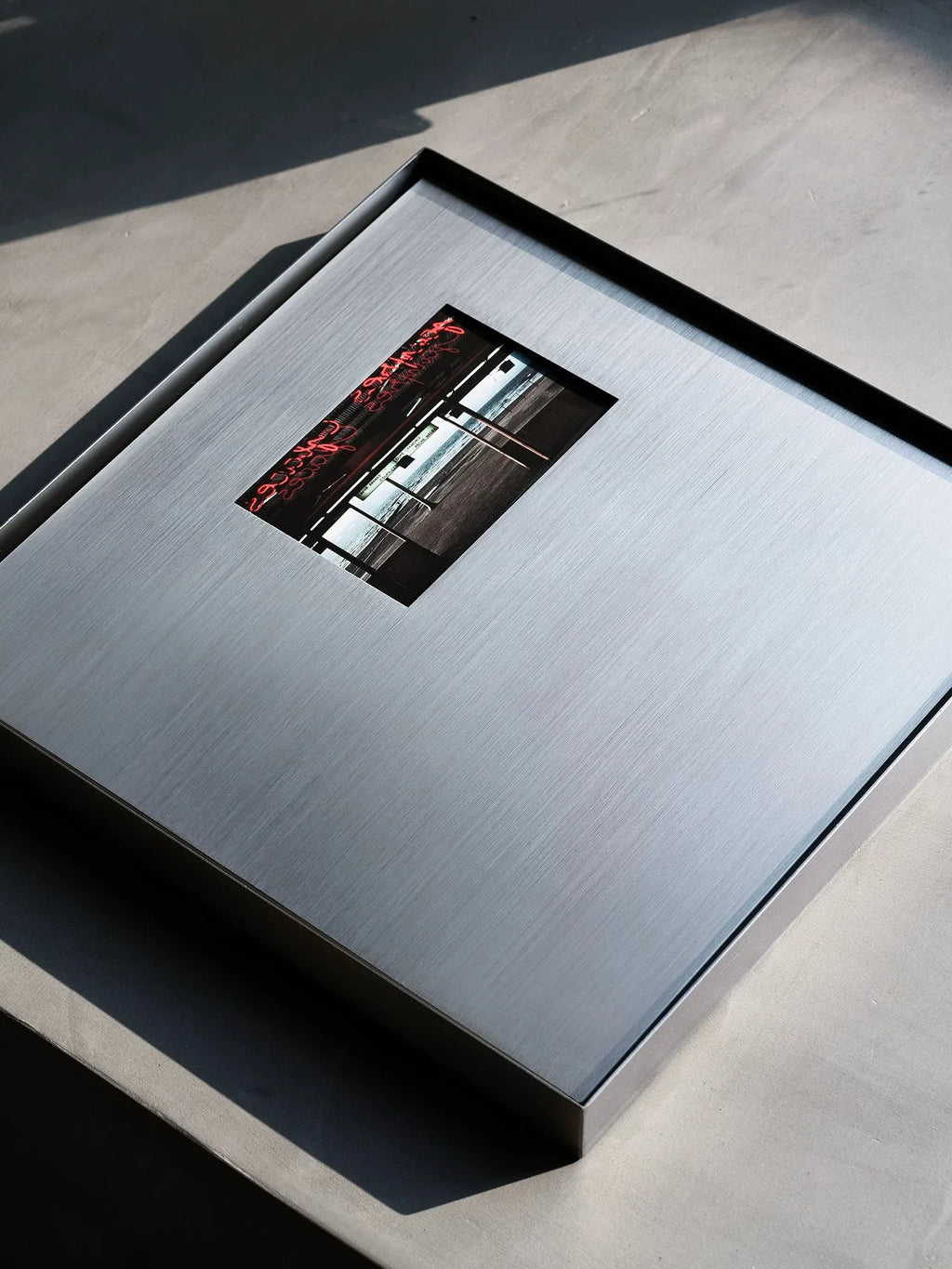 Square Stainless Steel Picture Frame in a bright modern space