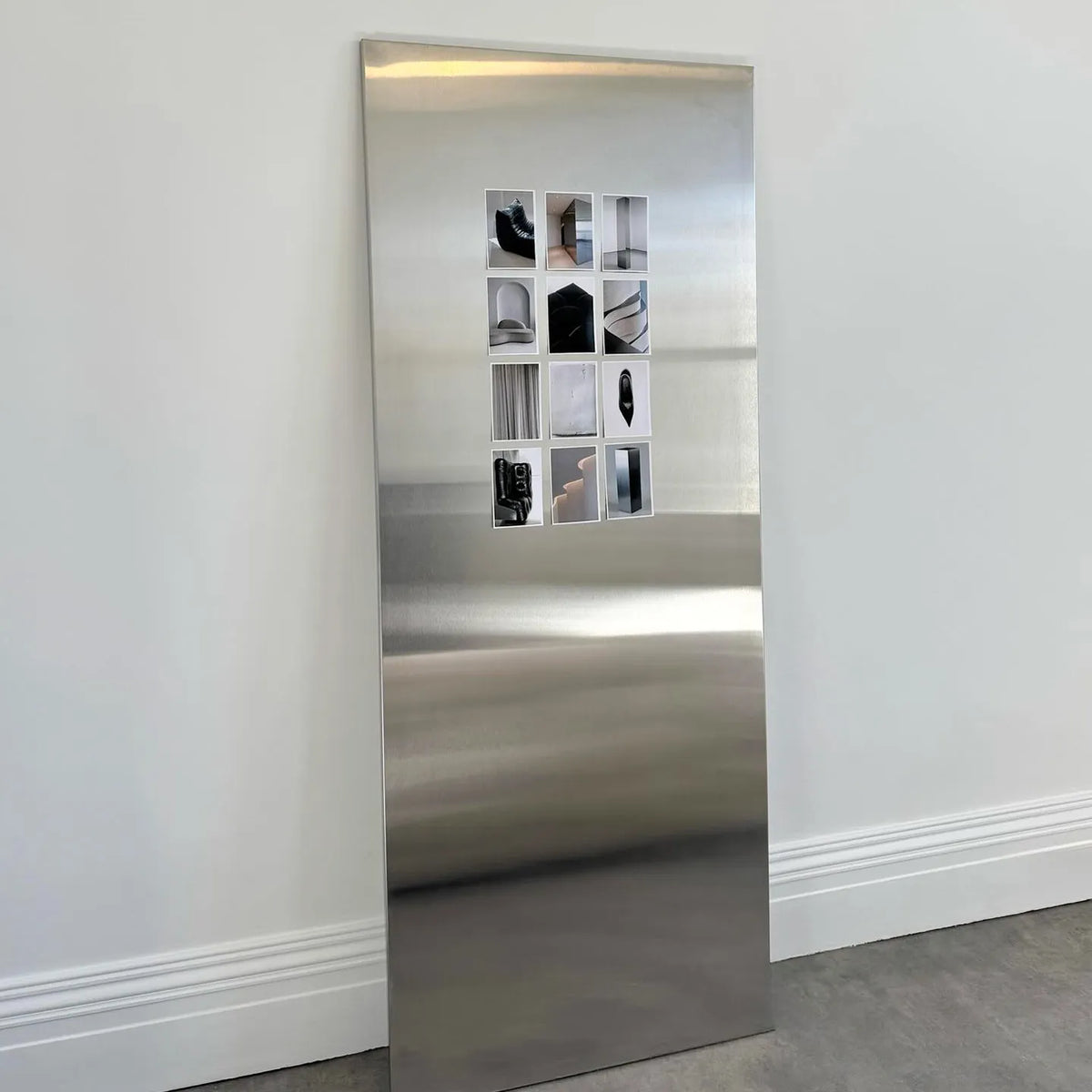 Frameless Stainless Steel Wall Art styled in a modern living room
