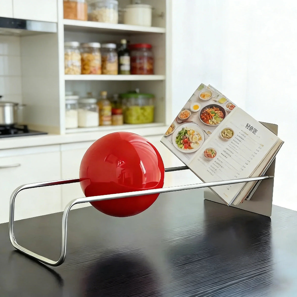 Sculptural Metal Desktop Organiser with a red sphere in a kitchen