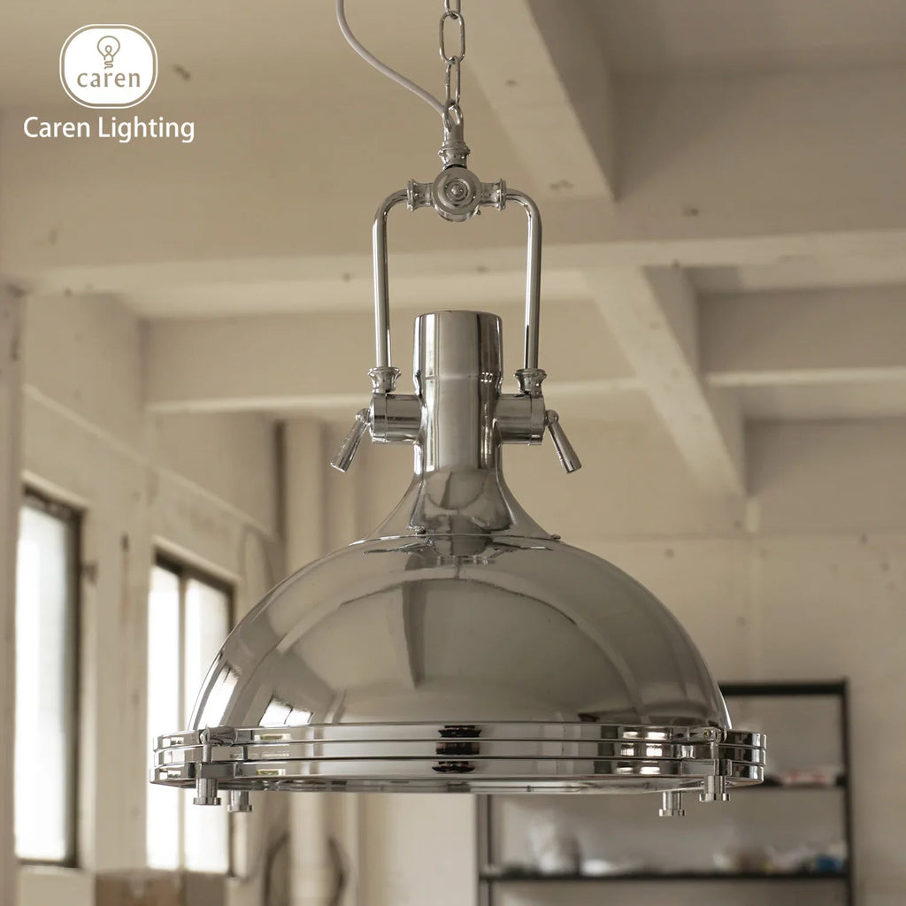 Industrial iron pendant light hanging in a bright room