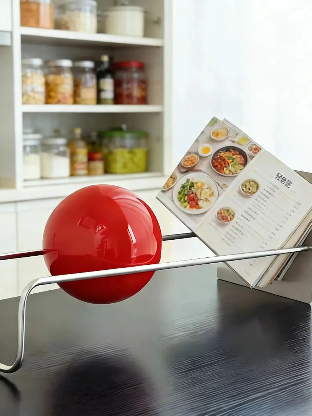 Sculptural Metal Desktop Organiser with a red sphere on a desk