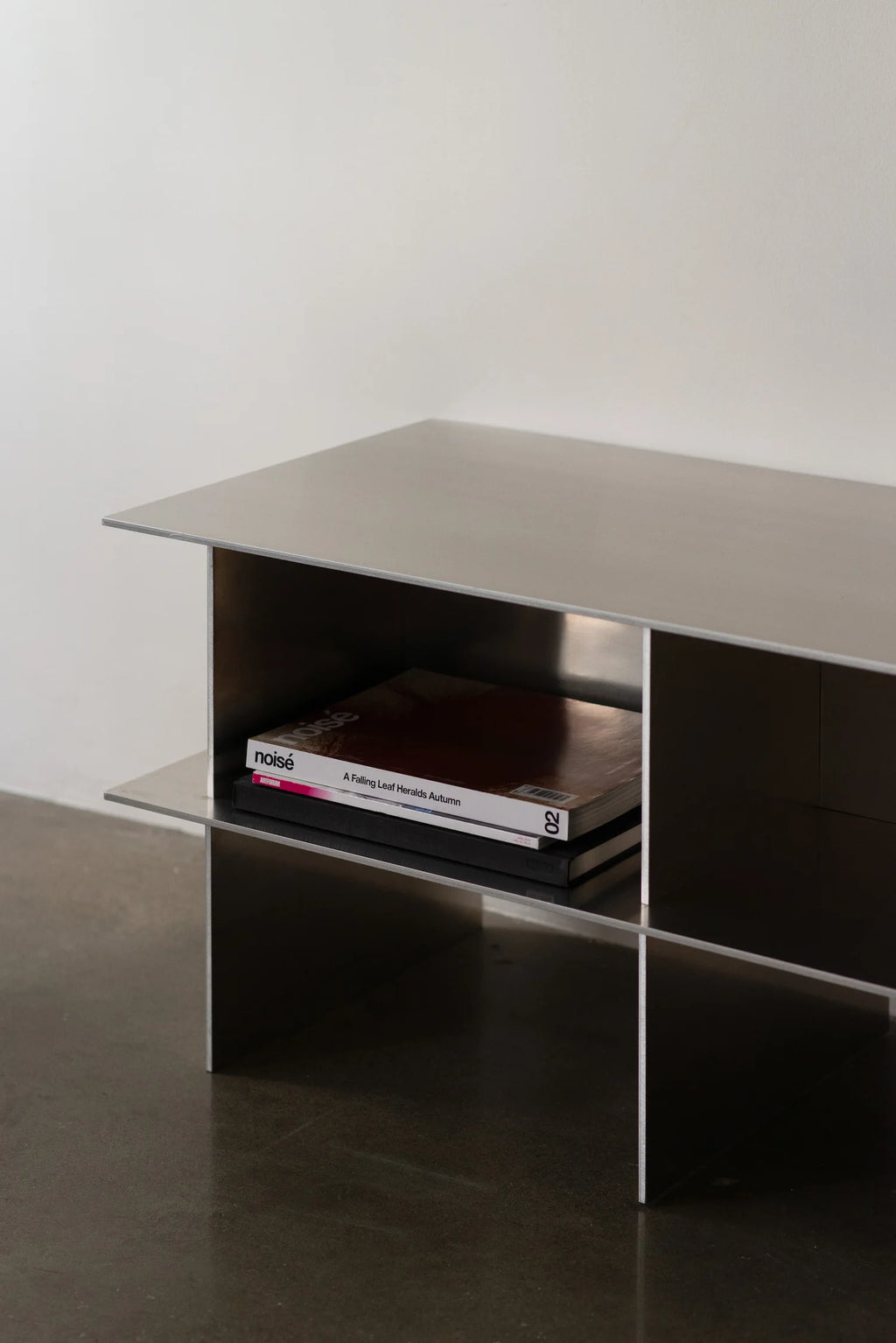 Glossy Metal Minimalist TV Stand in a minimalist interior setting