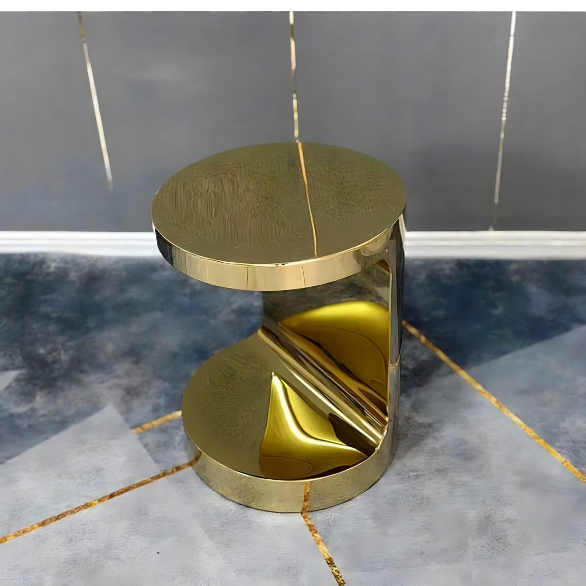 Gold C-shaped side table, angled view