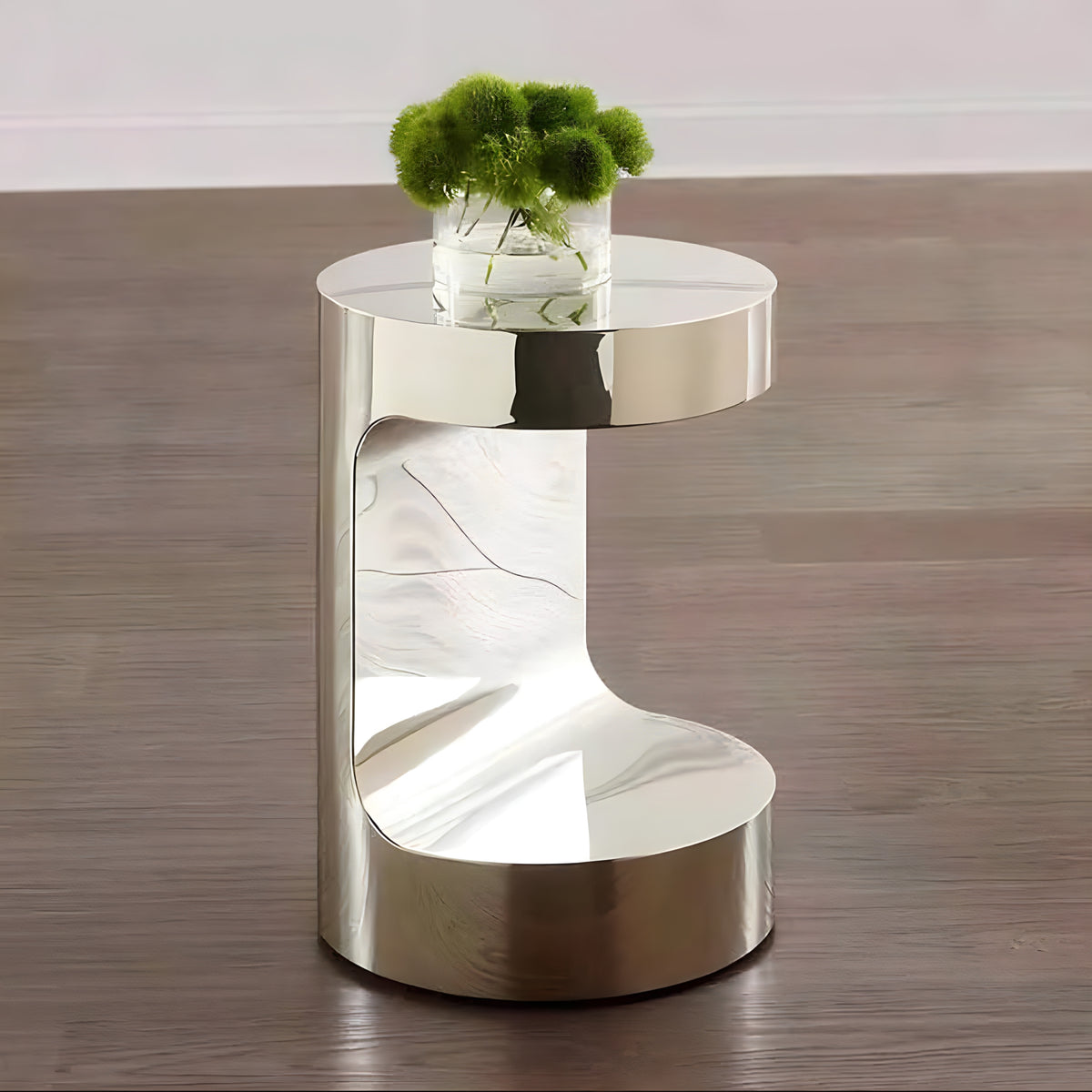 Mirror-polished C-shaped side table in silver