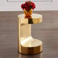 Mirror-polished C-shaped side table in gold