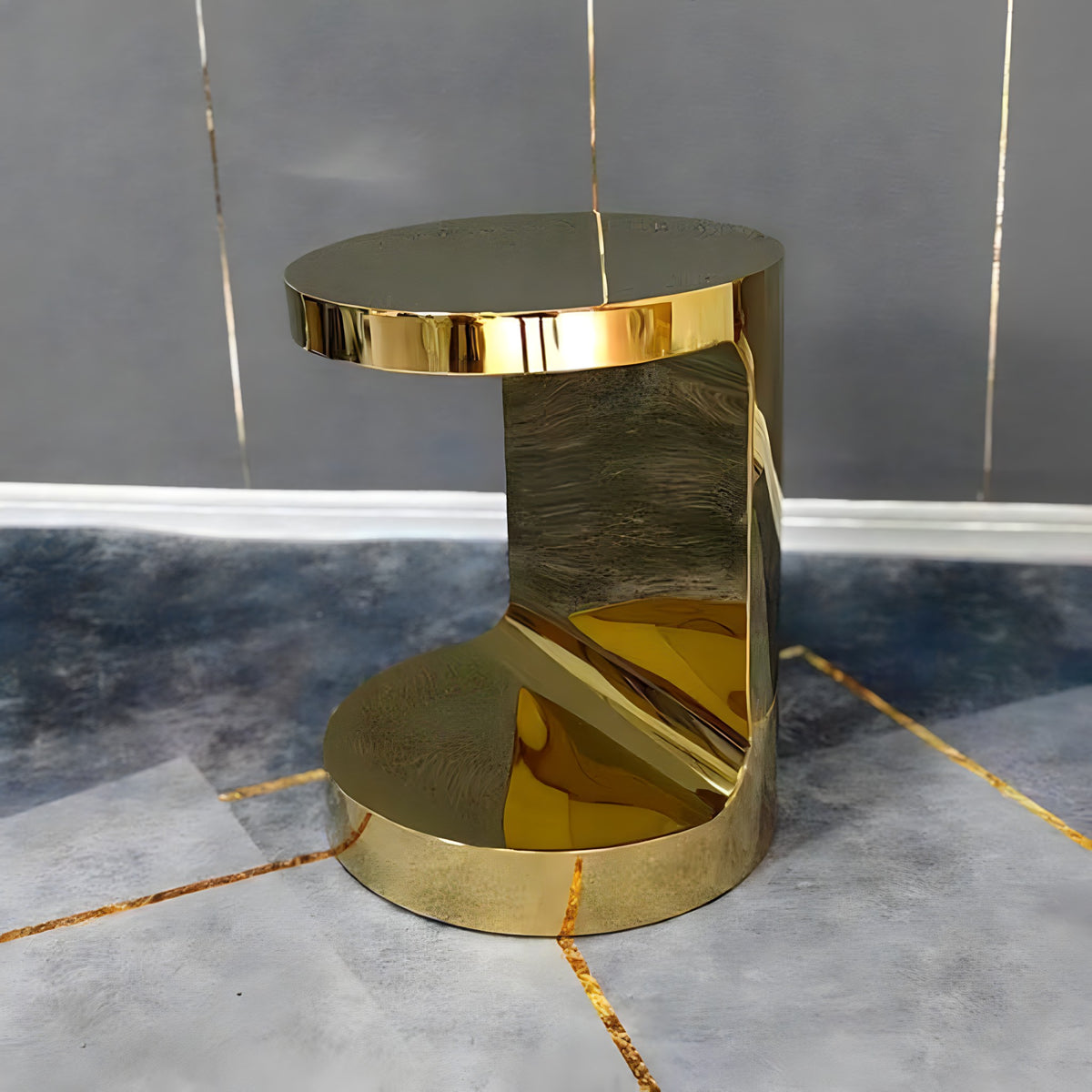 Gold C-shaped side table, side view