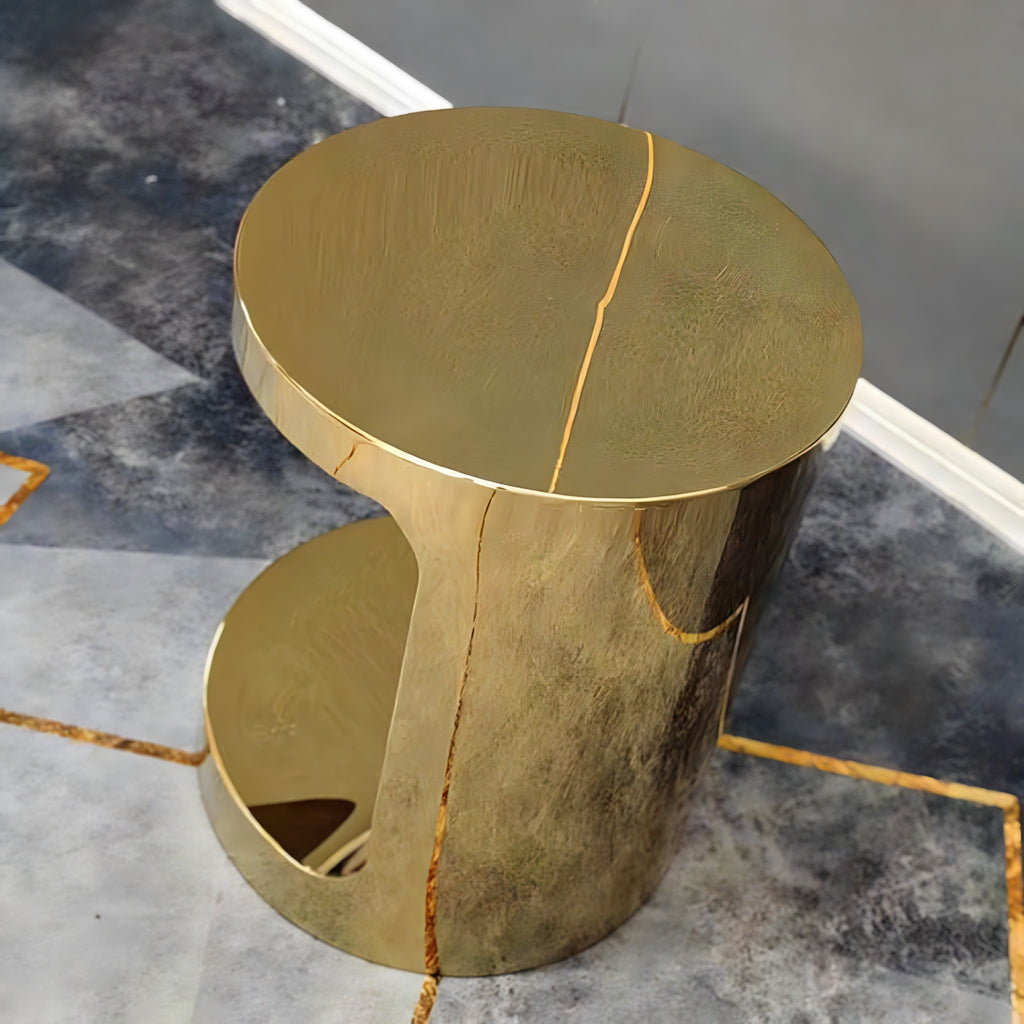 Gold C-shaped side table, detail of round top